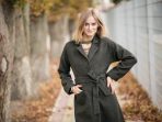 Girl in a coat posing Girl in a coat posing