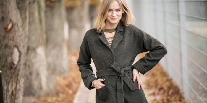 Girl in a coat posing