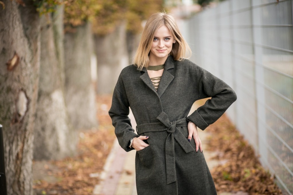 Girl in a coat posing Girl in a coat posing