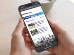 Ilustrasi Kebijakan Kuota Hangus Telekomunikasi Ilustrasi penggunaan smartphone dan layanan internet seluler terkait aturan kuota hangus telekomunikasi.