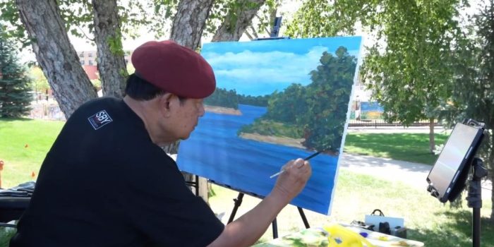 SBY melukis pemandangan Sungai Mississippi di Levee Park Minnesota.