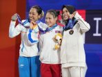 Luluk Diana Atlet Pacitan Rebut Perunggu Asian Games 2026 Luluk Diana Tri Wijayana, atlet asal Punung Pacitan, mengangkat beban di Asian Games 2026.