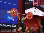 Luluk Diana Tri Wijayana, atlet asal Punung Pacitan, mengangkat beban di Asian Games 2026.