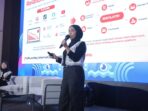 Direktur Bisnis Berita Jatim Saptini Darmaningrum memaparkan strategi membangun jejaring relasi bisnis dan komunitas di panggung Local Media Summit 2026 Jakarta.